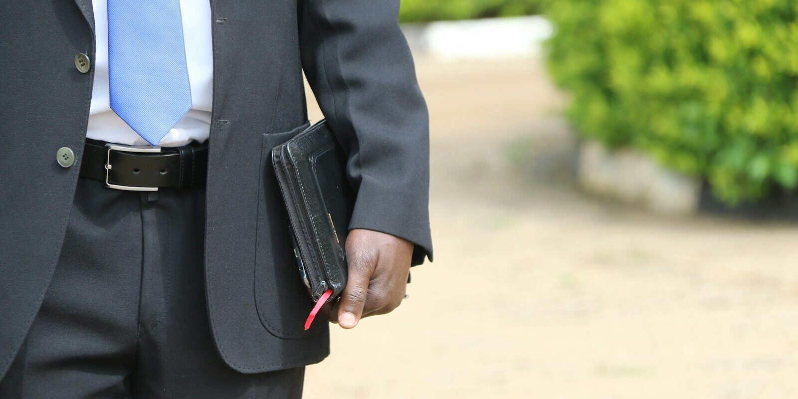 Businessman securing documents in a case, representing asset protection and pre-judgment attachment in Kenya