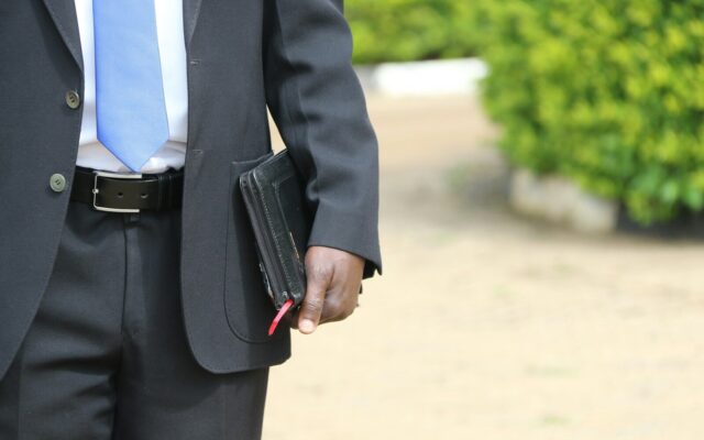 Businessman securing documents in a case, representing asset protection and pre-judgment attachment in Kenya