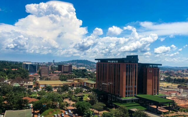 Aerial view of Kampala, Uganda, with modern buildings and clouds