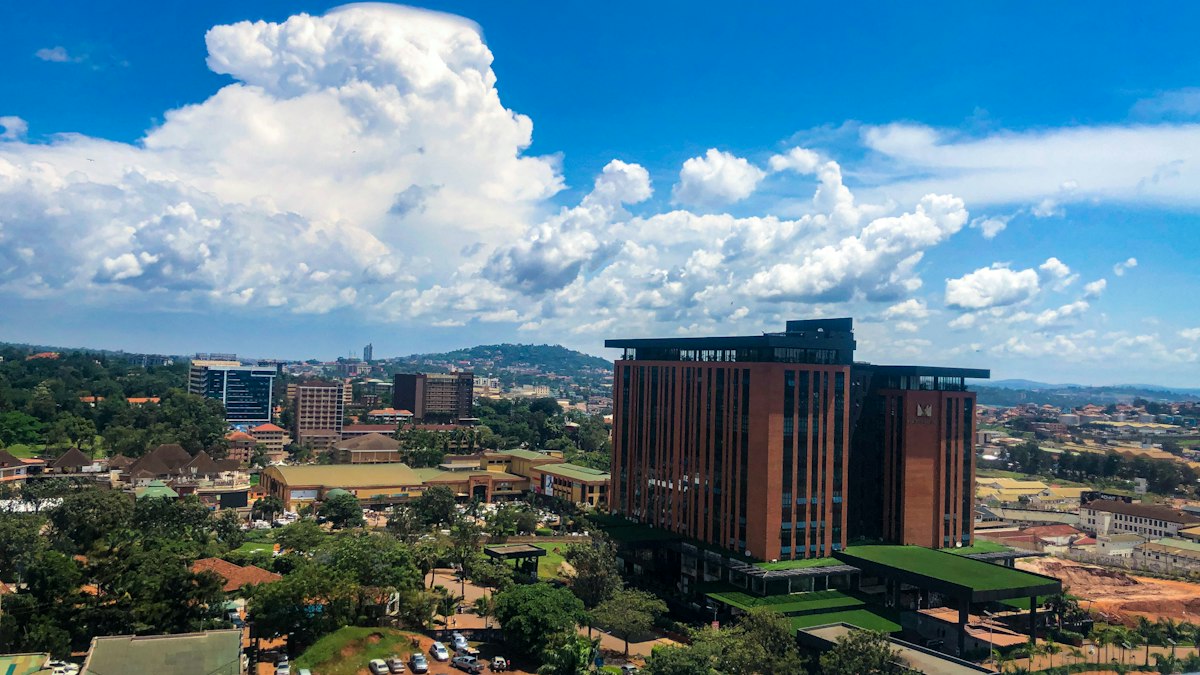 Aerial view of Kampala, Uganda, with modern buildings and clouds