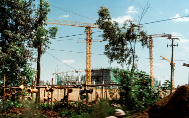 Real estate tokenisation in Kenya: tower cranes over a building site in a Kenyan city