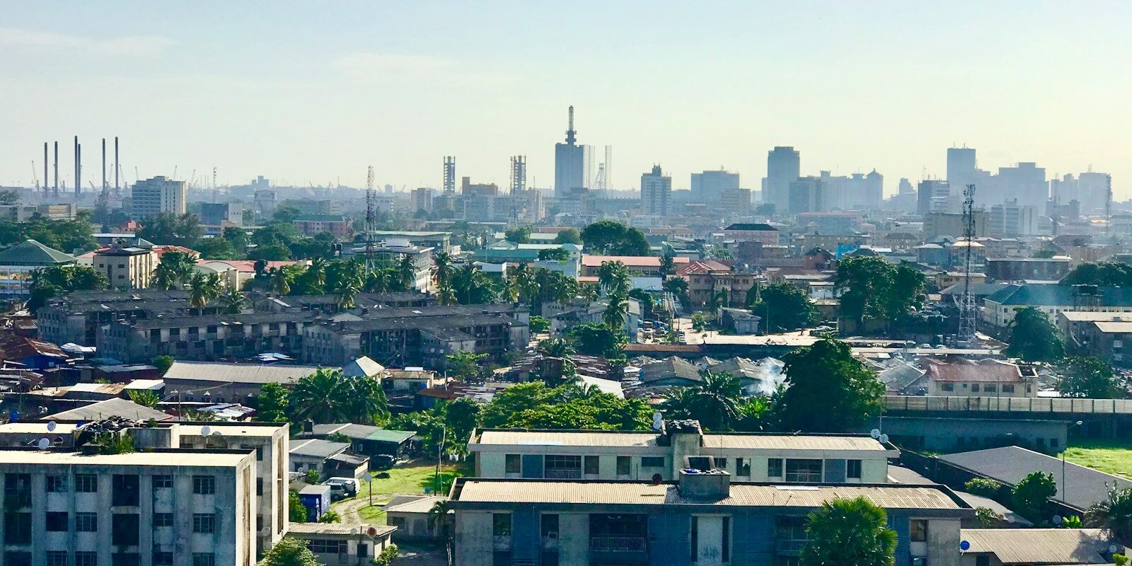 Aerial view of a West African city skyline with high-rise buildings