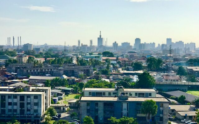 Aerial view of a West African city skyline with high-rise buildings