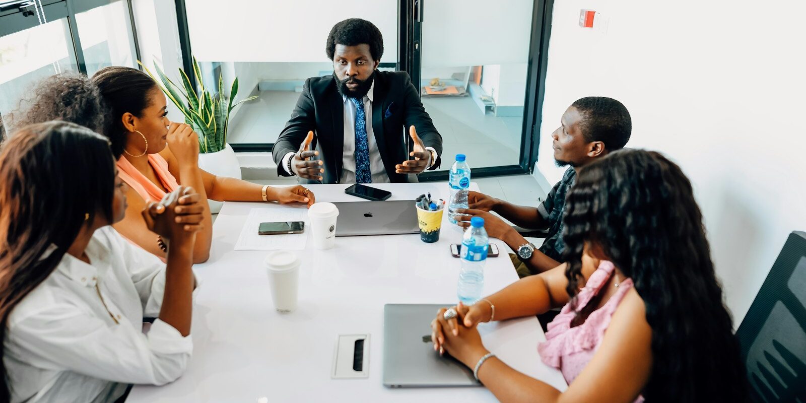 African professionals in a meeting discussing Kenya's work permit classes