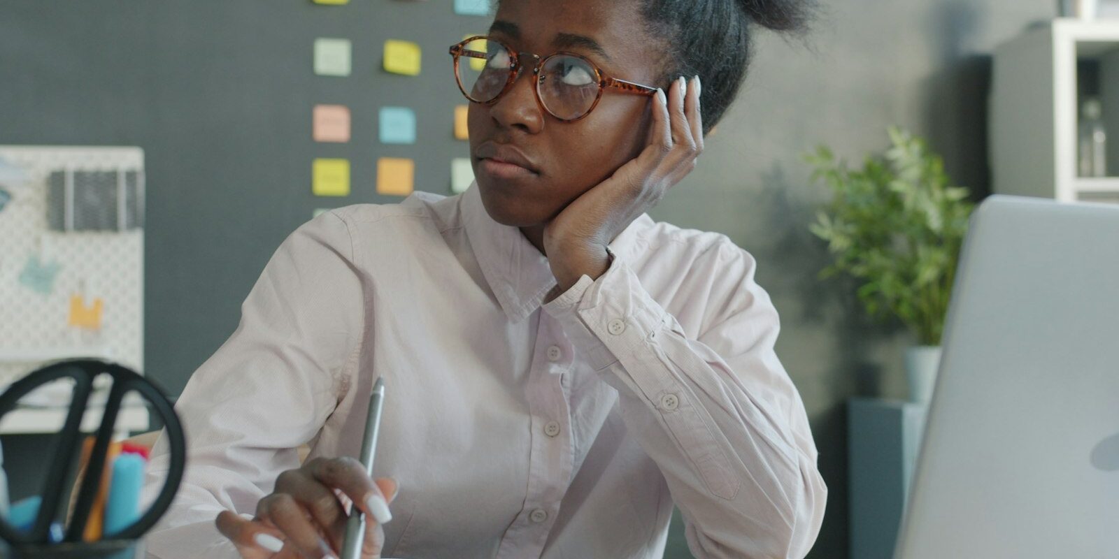 African businesswoman reviewing a rejected work permit application at her desk