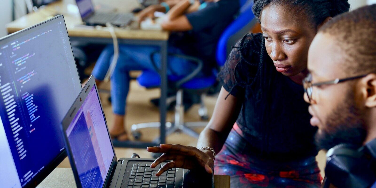 Technology and compliance team reviewing AI system code and data governance controls in Kenya