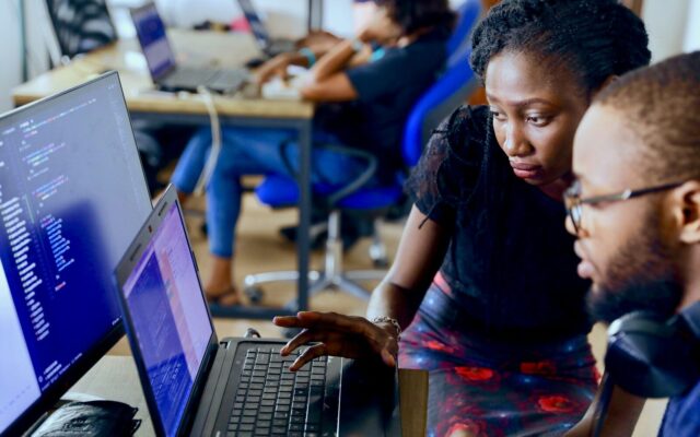 Technology and compliance team reviewing AI system code and data governance controls in Kenya