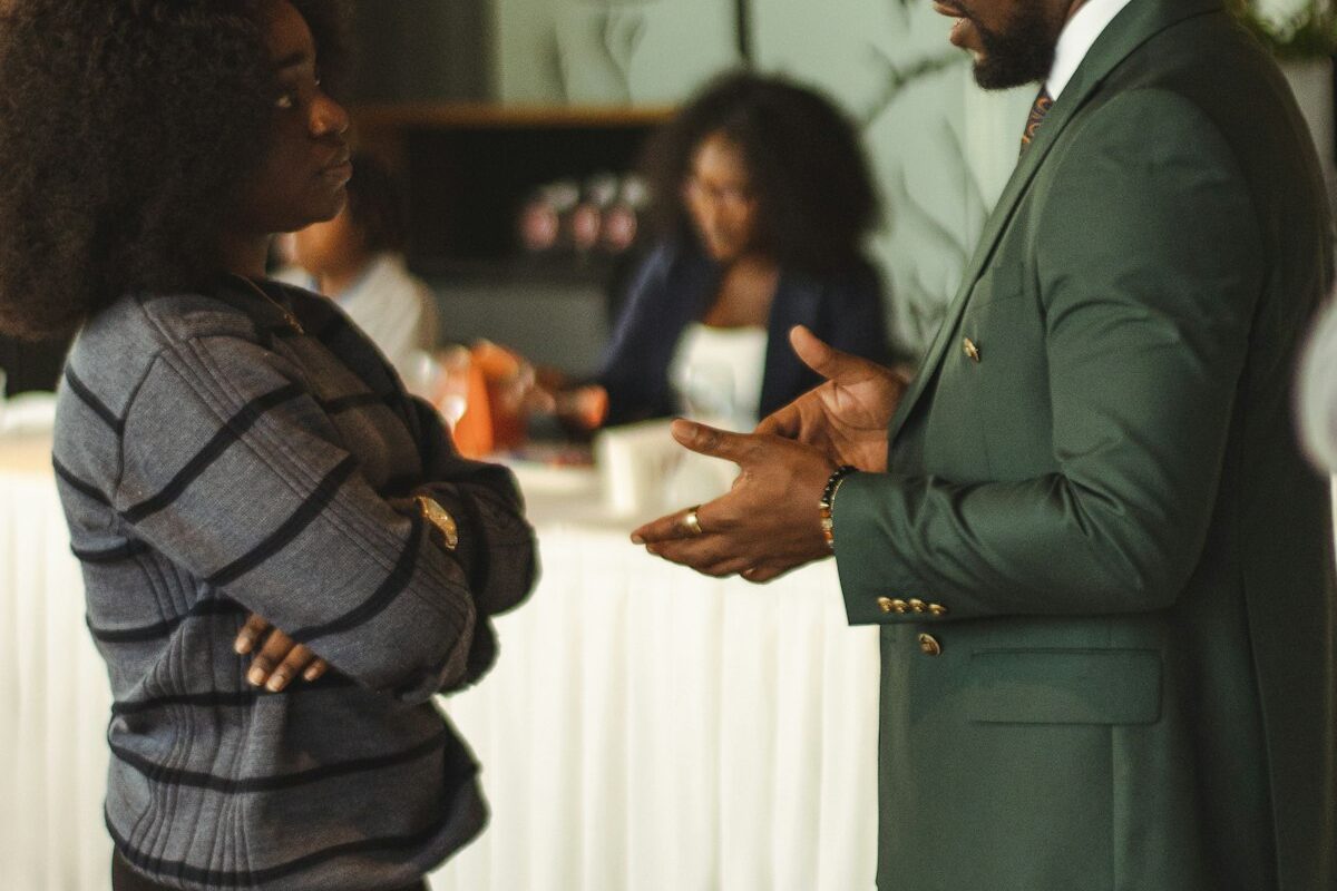 A lawyer discussing documents with a client in an office