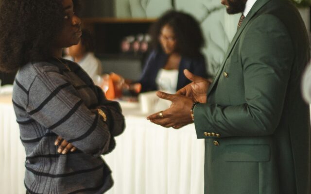A lawyer discussing documents with a client in an office