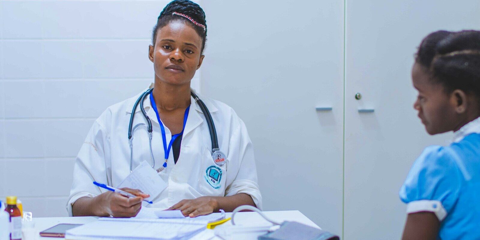 Doctor consulting with a patient at a fertility clinic in Kenya