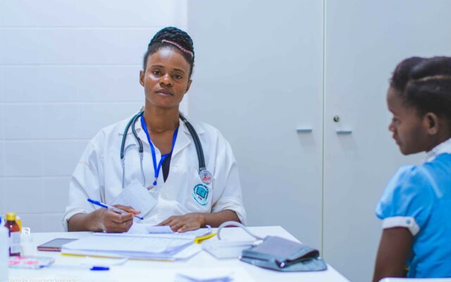 Doctor consulting with a patient at a fertility clinic in Kenya