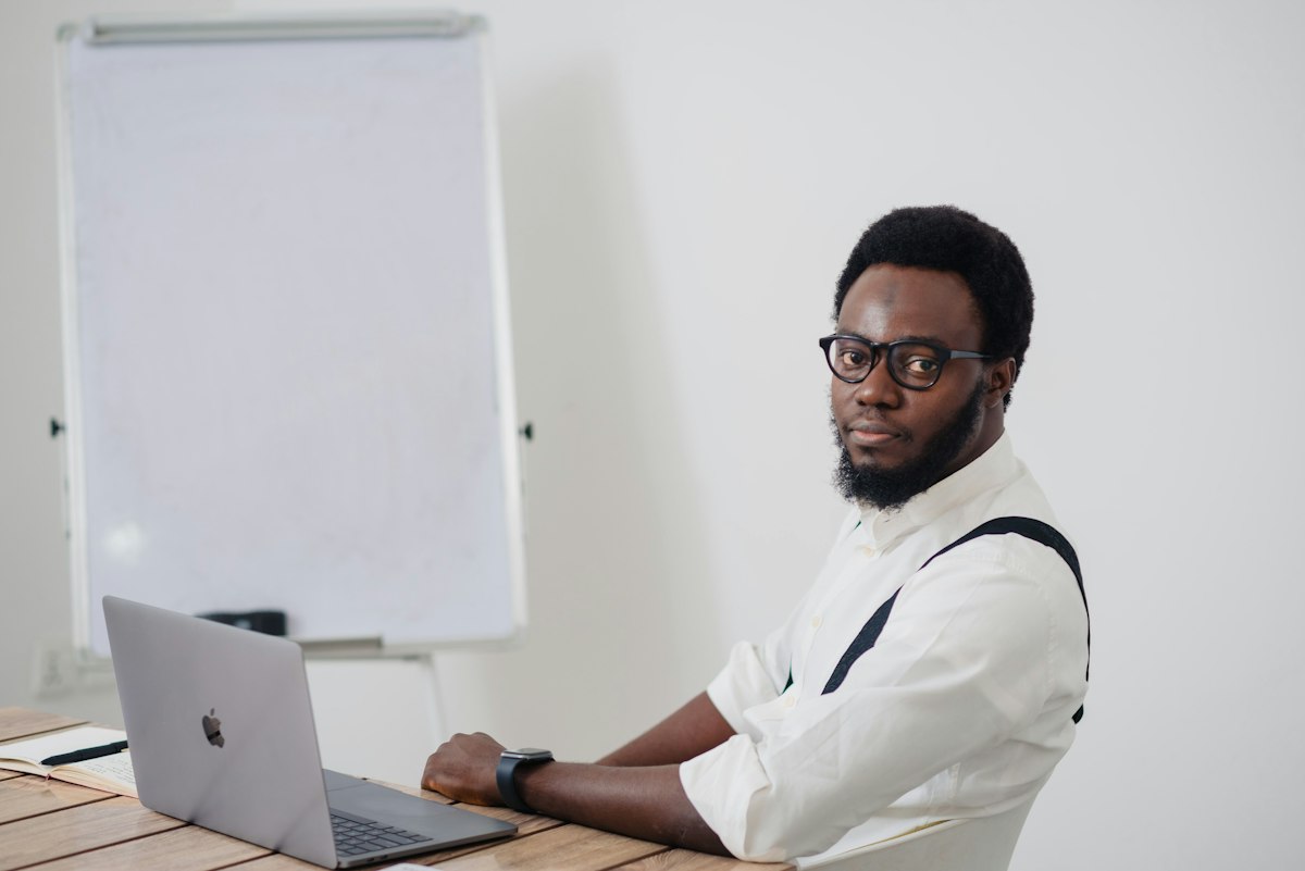 Advisor reviewing estate documents on a laptop for a diaspora beneficiary