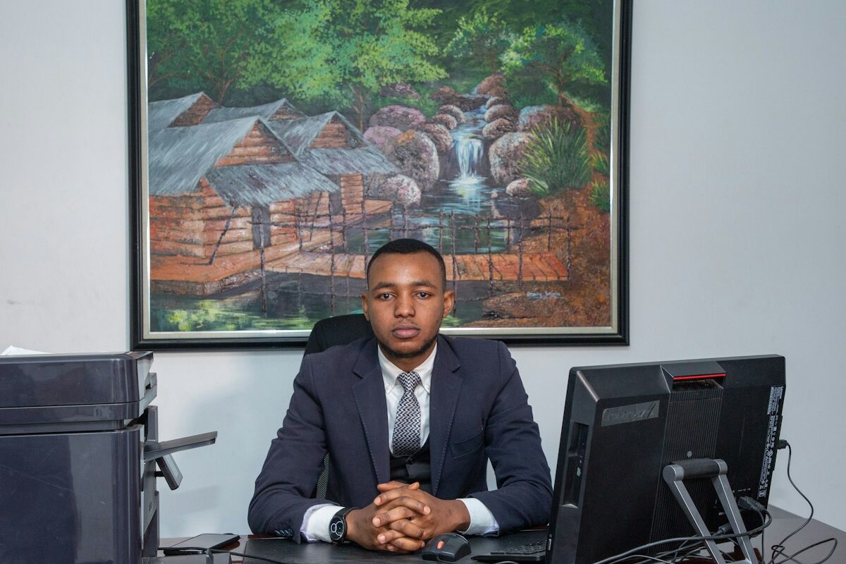 Kenyan employer at office desk reviewing a termination matter