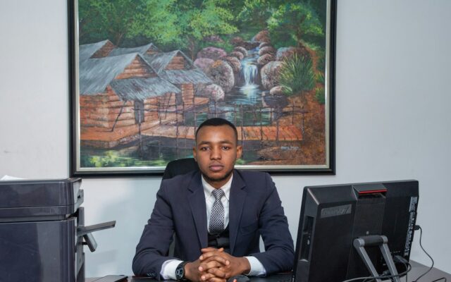 Kenyan employer at office desk reviewing a termination matter
