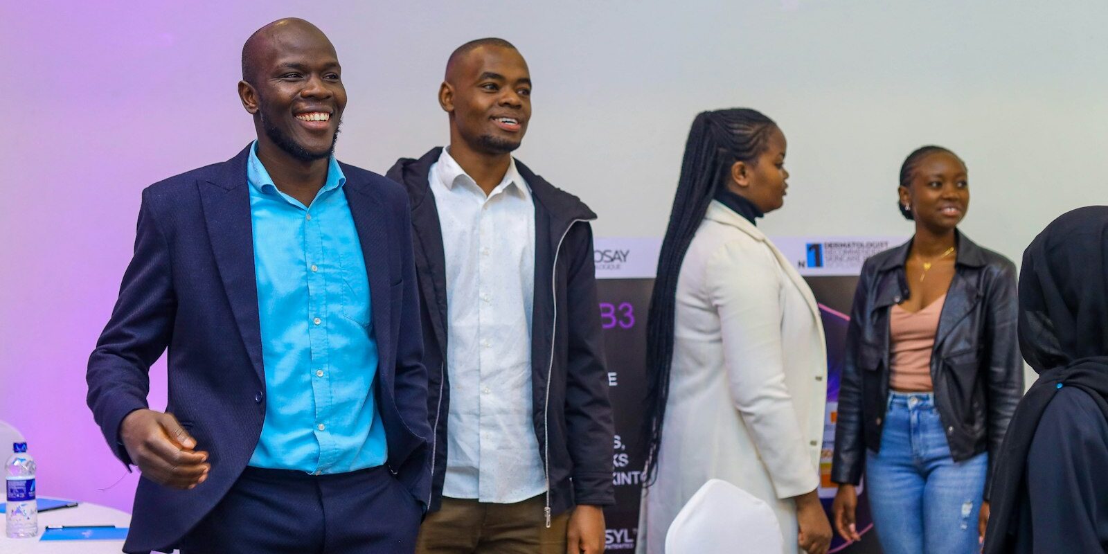 Diverse professional team at a Nairobi corporate event, relocating for work in Kenya