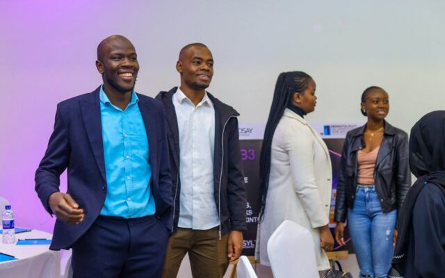 Diverse professional team at a Nairobi corporate event, relocating for work in Kenya