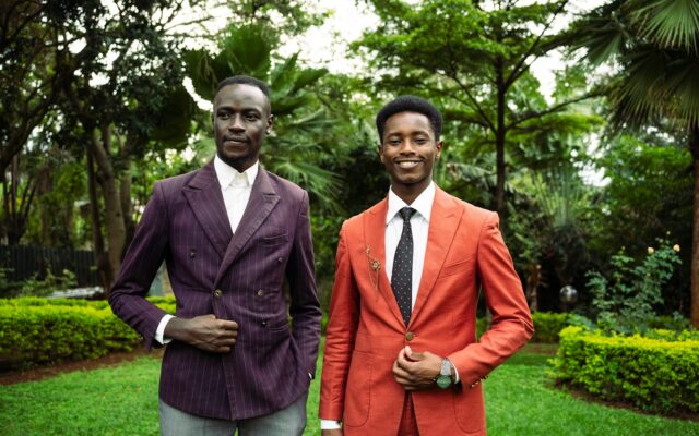 Two Kenyan business executives in suits, representing board composition choices for a foreign-owned company