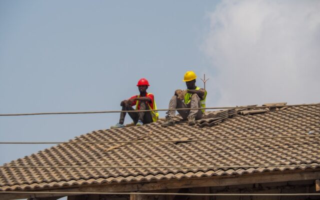 Construction workers on a building site illustrating retention and performance bonds in Kenya