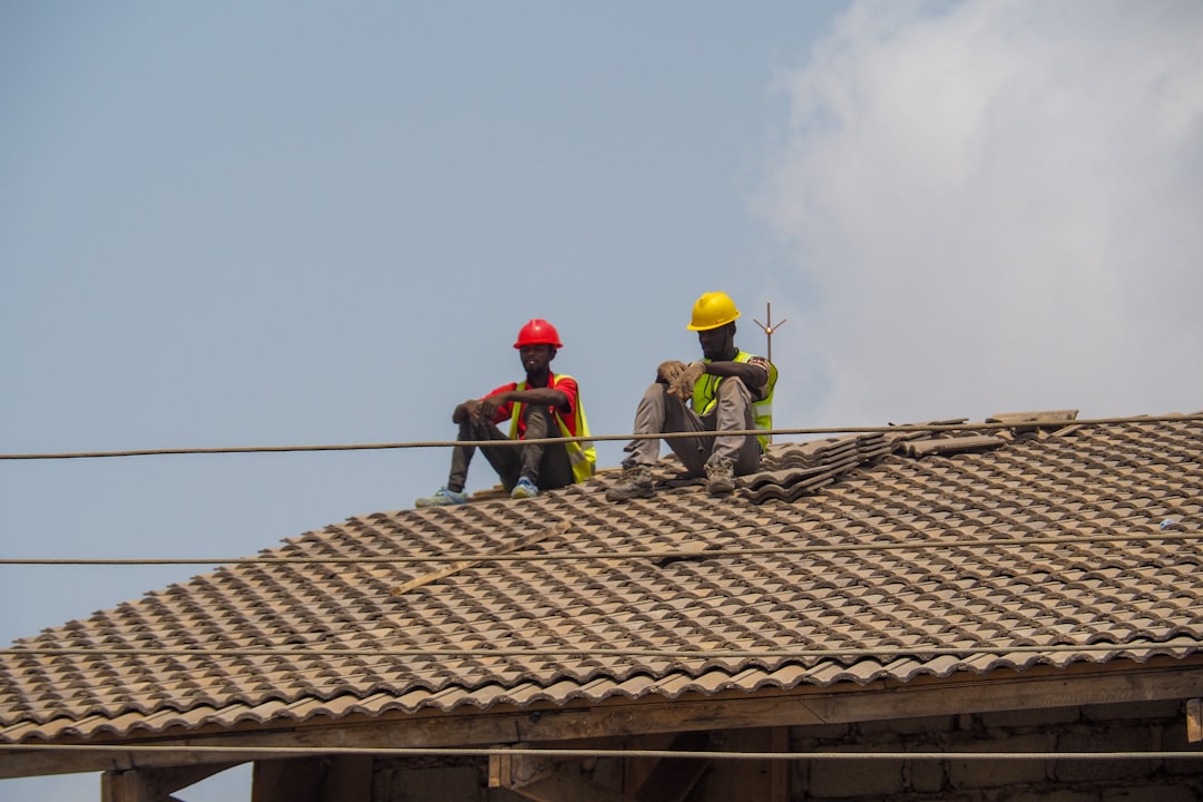 Construction workers on a building site illustrating retention and performance bonds in Kenya
