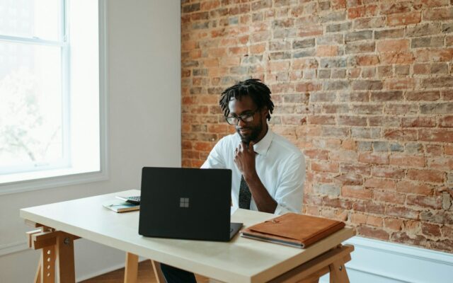 A man working alone at a laptop, representing a single company director