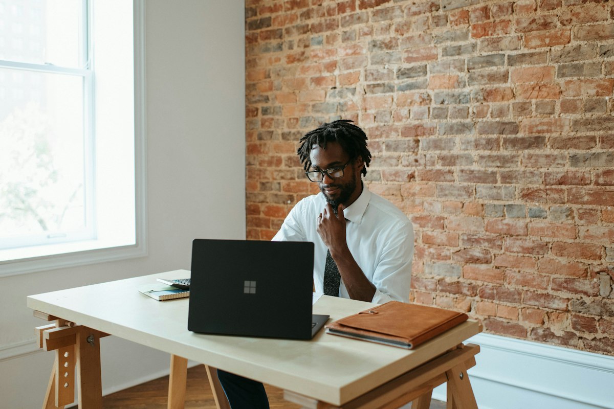 A man working alone at a laptop, representing a single company director