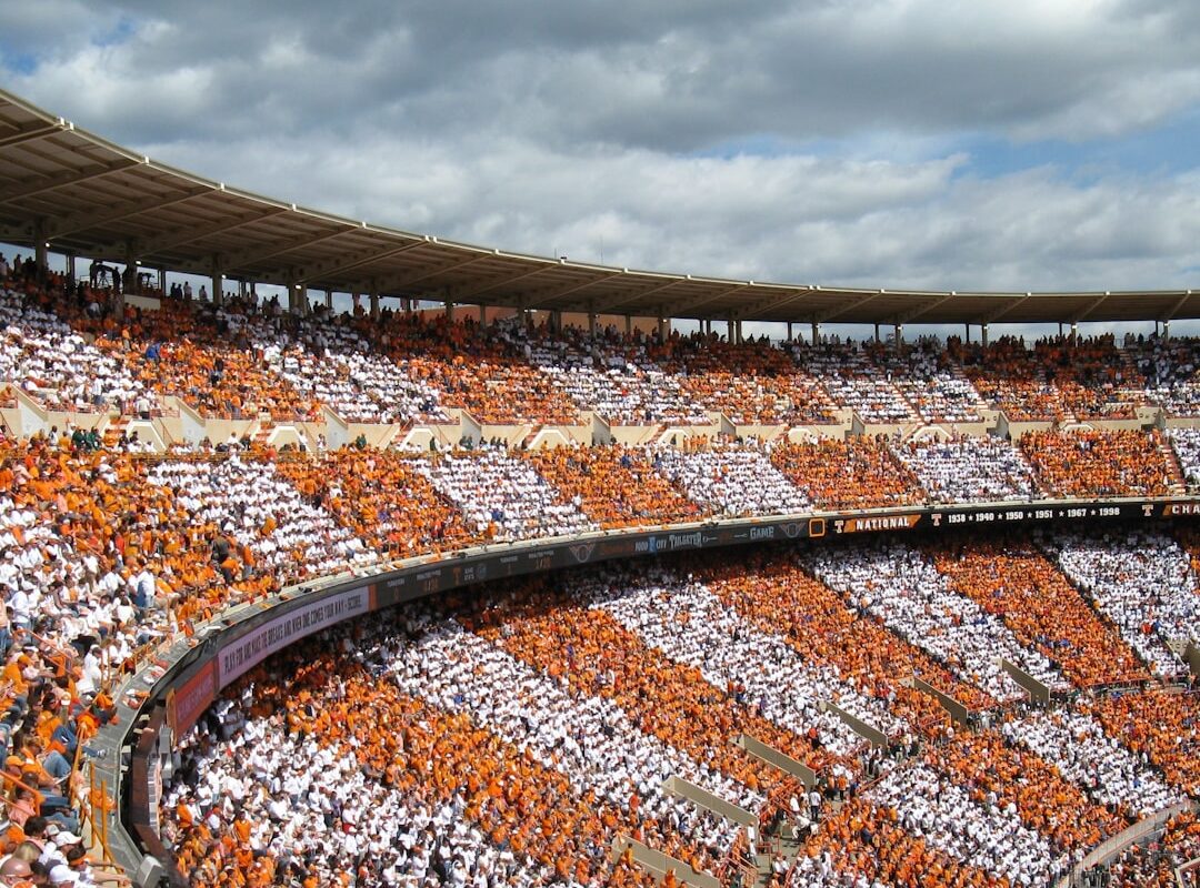 Stadium exterior under clouds representing funding under the Sports, Arts and Social Development Fund in Kenya