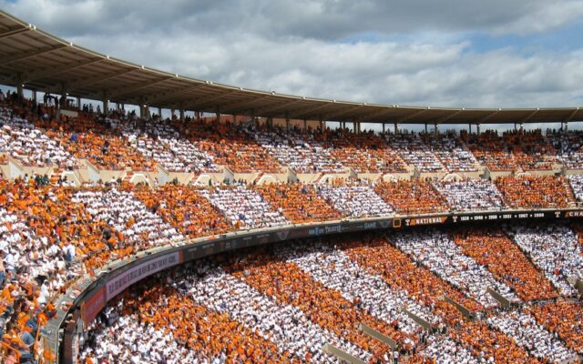 Stadium exterior under clouds representing funding under the Sports, Arts and Social Development Fund in Kenya