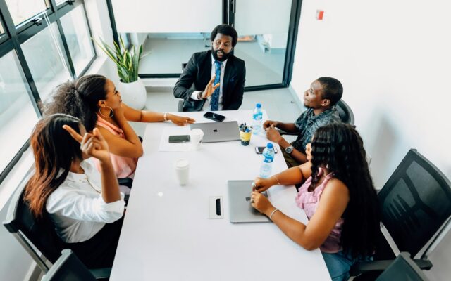 A group of businesswomen in a boardroom meeting