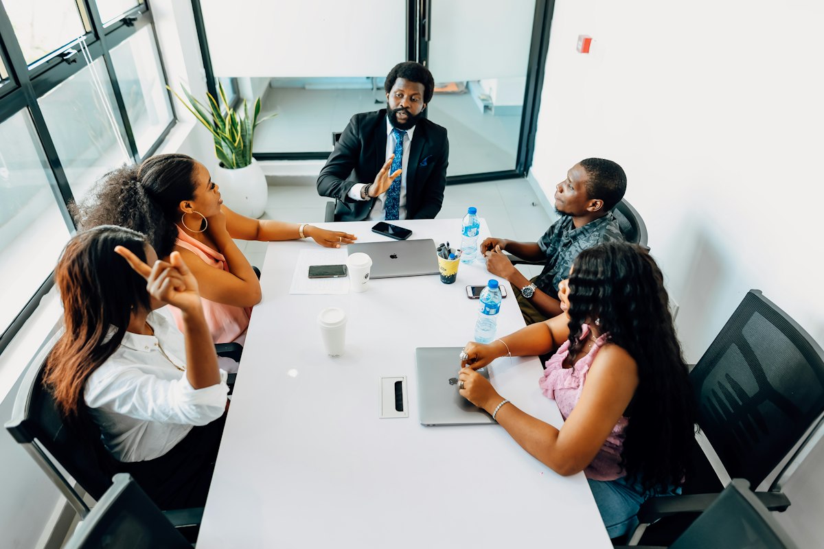 A group of businesswomen in a boardroom meeting