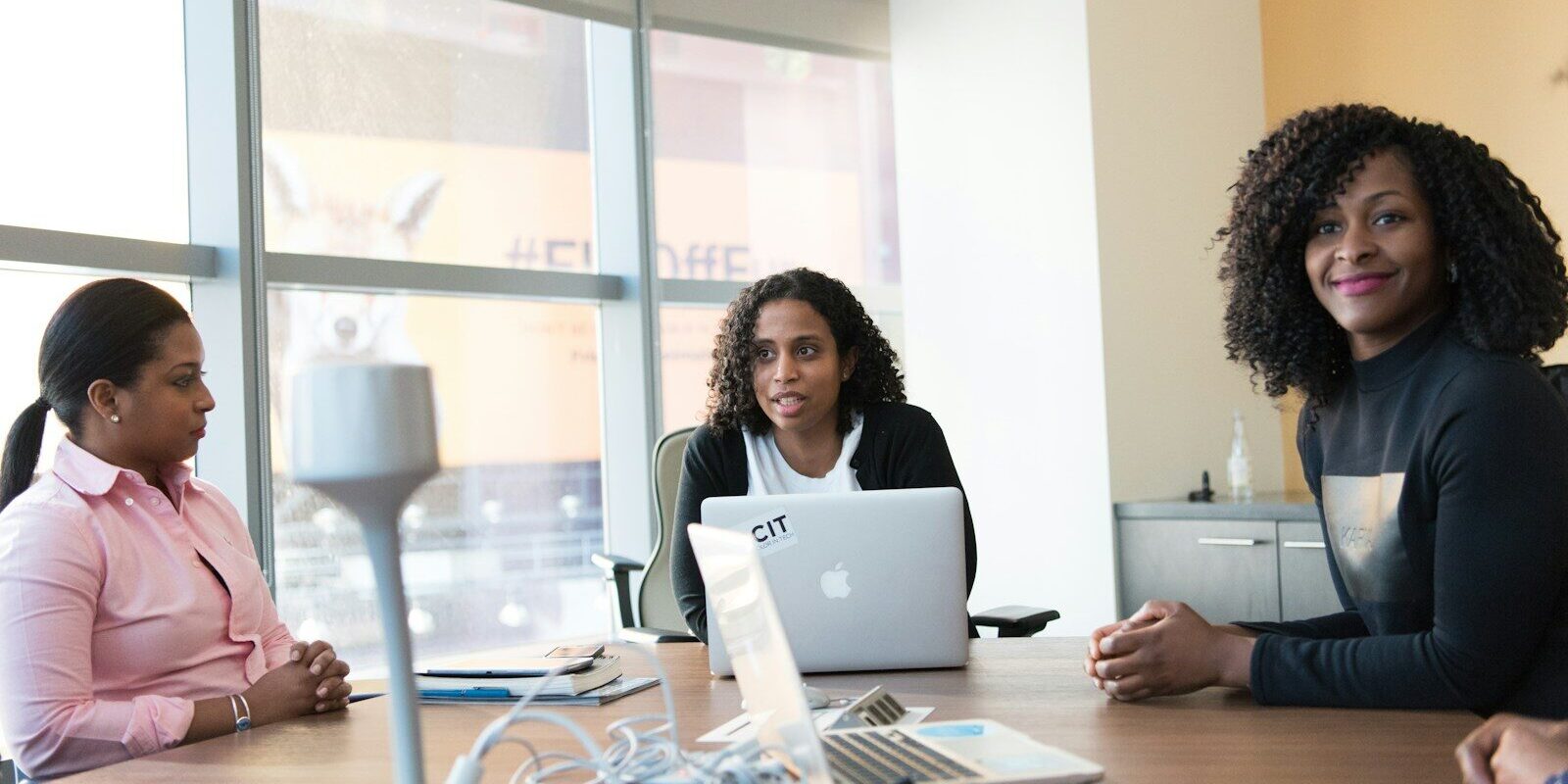 African businesswomen reviewing venture financing term sheet in Kenya office