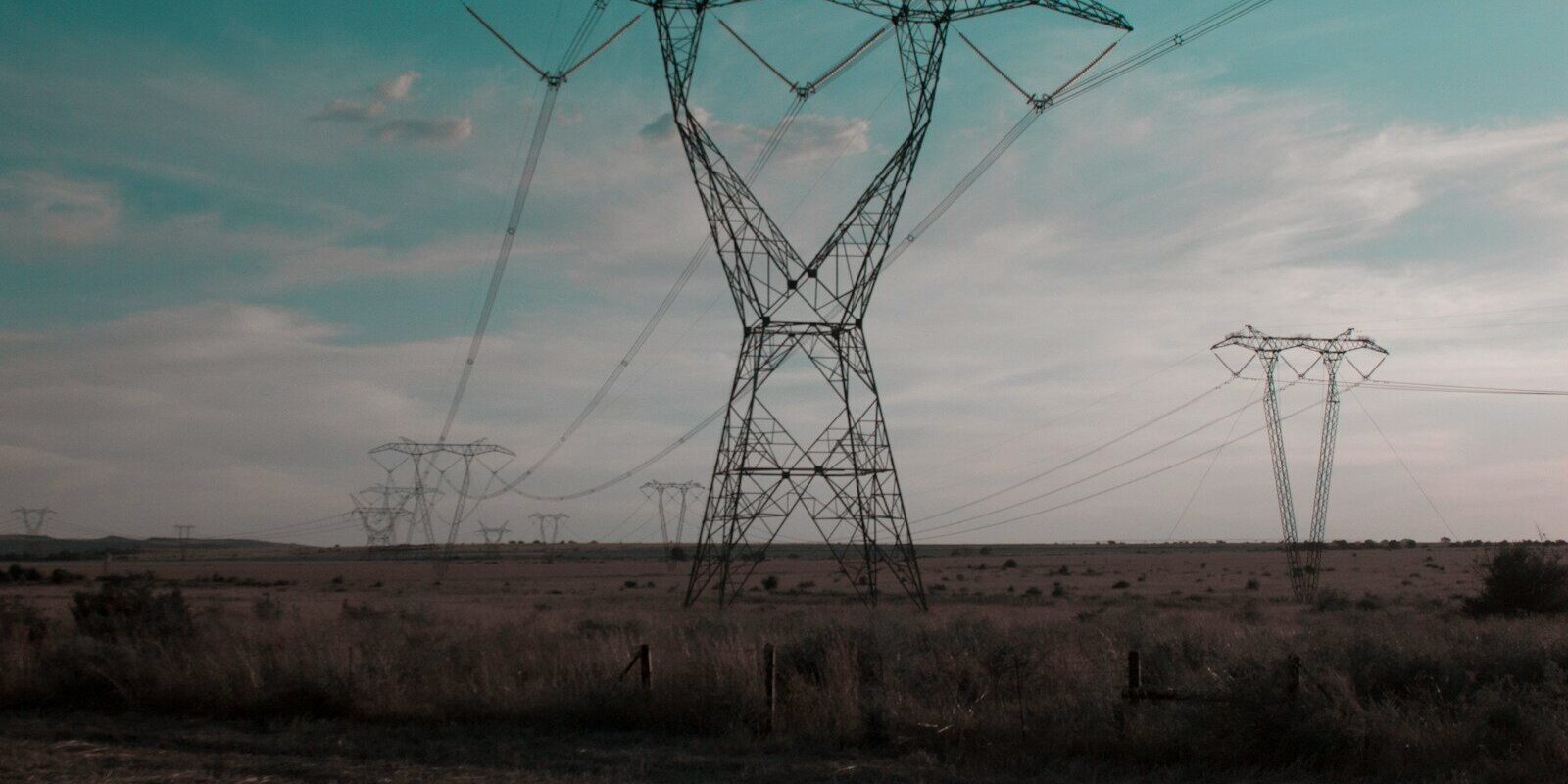 High-voltage electricity transmission towers carrying power across the grid to connect large loads such as data centres in Kenya