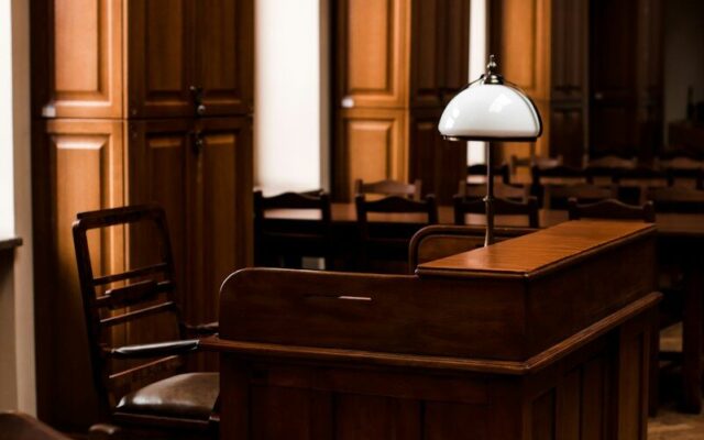 Wood-panelled office with a lamp and desk, illustrating a formal written ruling from the tax authority