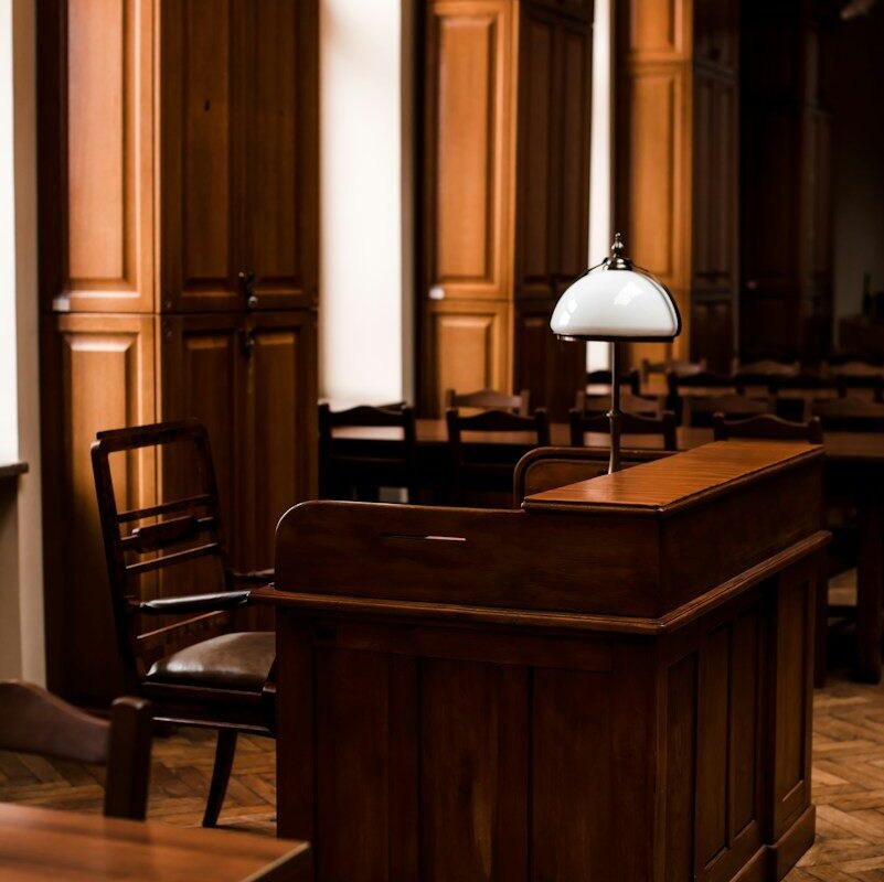Wood-panelled office with a lamp and desk, illustrating a formal written ruling from the tax authority