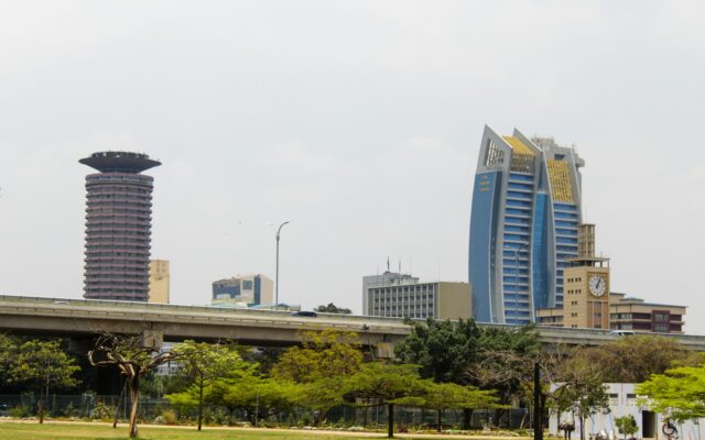 Nairobi towers and city park under an overcast sky